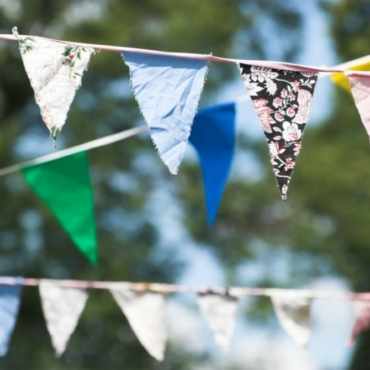 garden treasure hunt ideas - tie strings of pretty bunting in multi-coloured fabric to keep players in certain areas