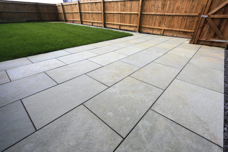 a close-up of a sleek patio made from grey paving stones
