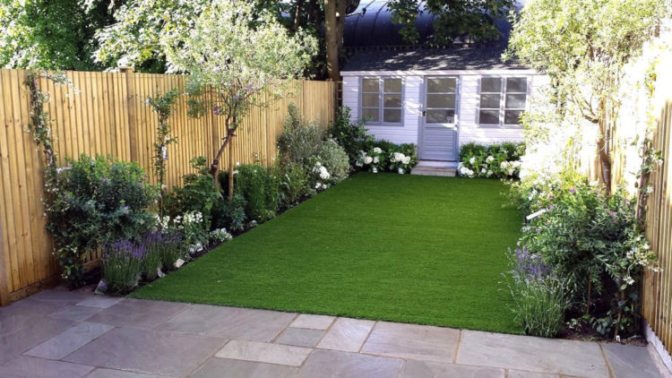 low-maintenance garden ideas with an artificial lawn, flower beds and a garden shed
