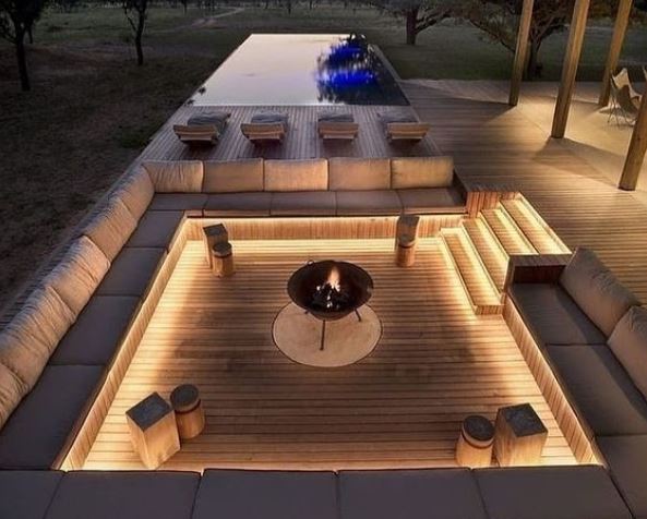 a luxurious garden conversation pit with under-seat lighting