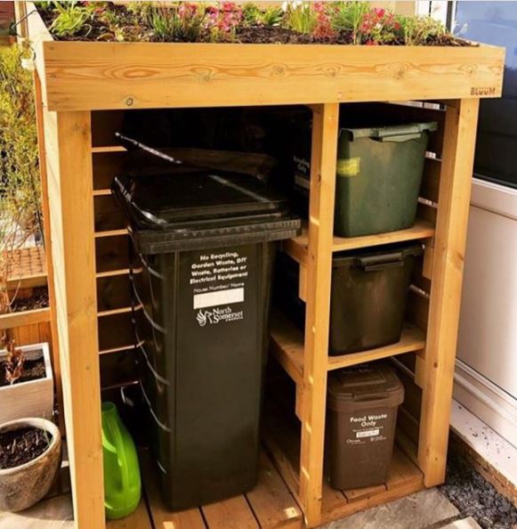 Bin Storage Ideas: How to Hide Your Wheelie Bins and Conceal Your Compost 5 a bin shelter with a tall section for a wheelie bin and three shelves for recycling boxes