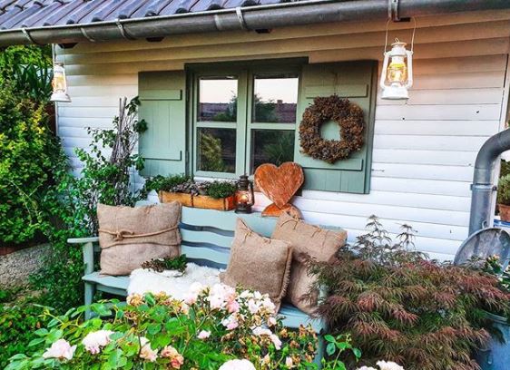 16 Vintage Garden Decor Ideas: Upcycle Glamour to a Garden 7 a cute garden bench beneath a shuttered window, both painted sage green