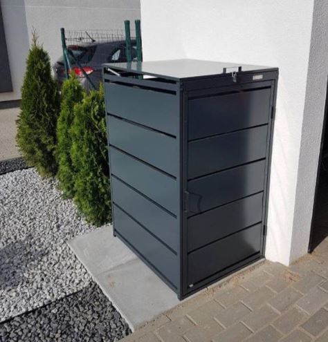 Bin Storage Ideas: How to Hide Your Wheelie Bins and Conceal Your Compost 3 a narrow metal bin storage unit next to the driveway of a house