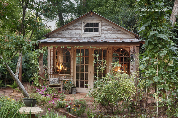 23 Cool Garden Man Cave Ideas to Pimp Your Outdoor Shed 18 a rustic, weathered wooden shed with large windows and a covered porch