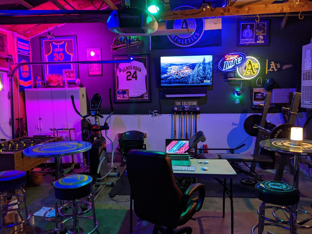 23 Cool Garden Man Cave Ideas to Pimp Your Outdoor Shed 6 a sports-bar style man cave, with bar stools, gym equipment, neon lights and framed sports shirts