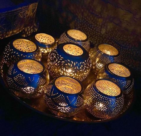 8 Morocco Garden Ideas to Design Your Own Moroccan Courtyard 16 Morocco themed garden ideas using a tray of ornate silver tealight holders with little candles inside