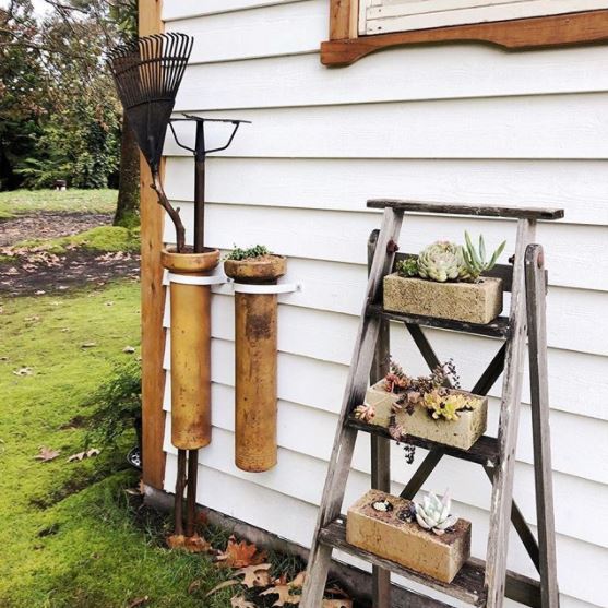 16 Vintage Garden Decor Ideas: Upcycle Glamour to a Garden 11 a weathered step ladder that has an old brick on every step, each growing succulents out of them
