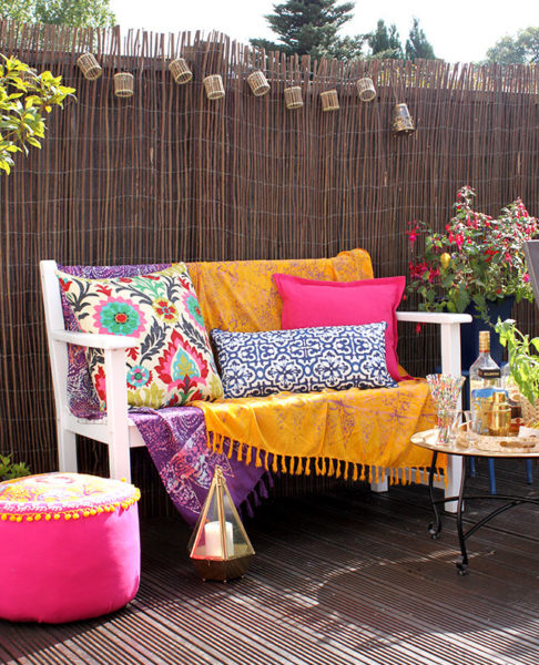 8 Morocco Garden Ideas to Design Your Own Moroccan Courtyard 3 Moroccan themed garden ideas with a bench that has coordinated cushions in mustard yellow, hot pink, bright purple and deep blue