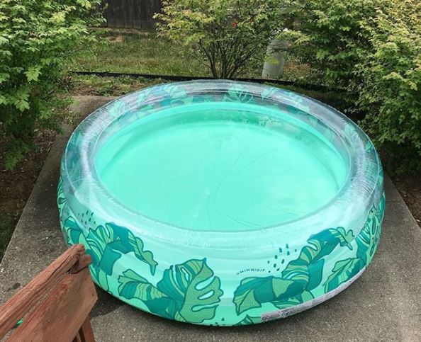 an adult-sized inflatable paddling pool, in a fun, tropical leaf print
