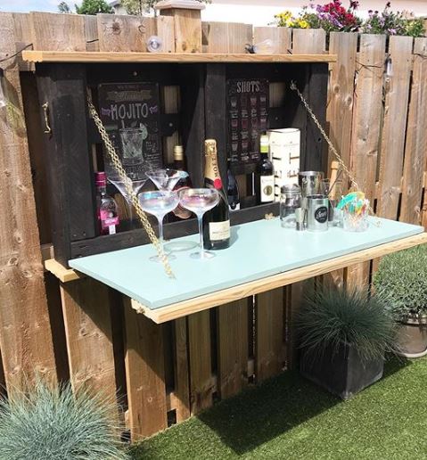 an unfolded murphy bar, showing bottles inside