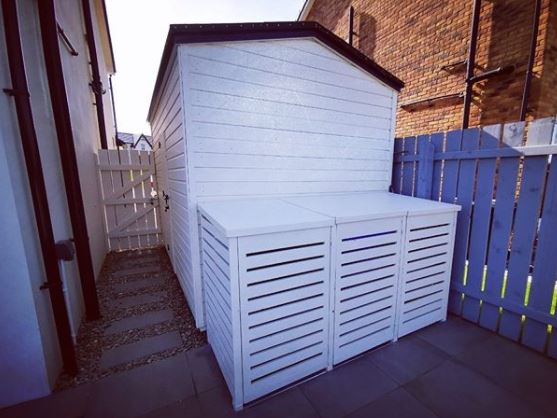 Bin Storage Ideas: How to Hide Your Wheelie Bins and Conceal Your Compost 9 bin storage ideas next to a shed, painted the same colour to blend in