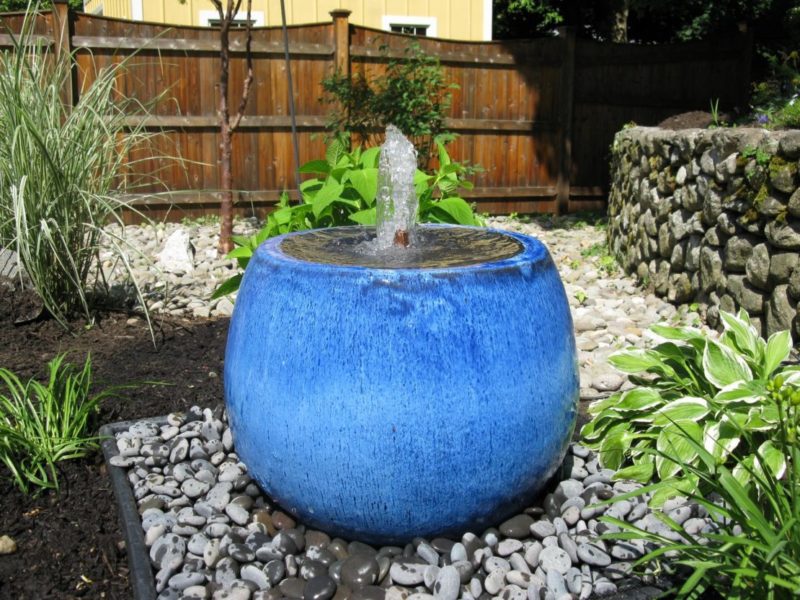 14 Stunning Garden Water Feature Ideas: Finding a Fountain for Your Home 1 a small bubble fountain in a large blue pot