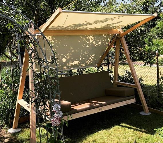a contemporary garden swing bench with an adjustable canopy