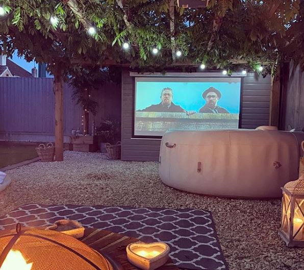 garden cinema ideas with hot tub and fire pit