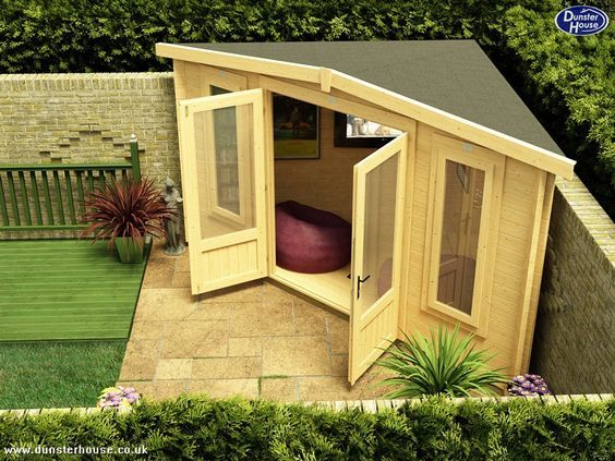 garden woman cave ideas - a triangular shed in the corner of a patio
