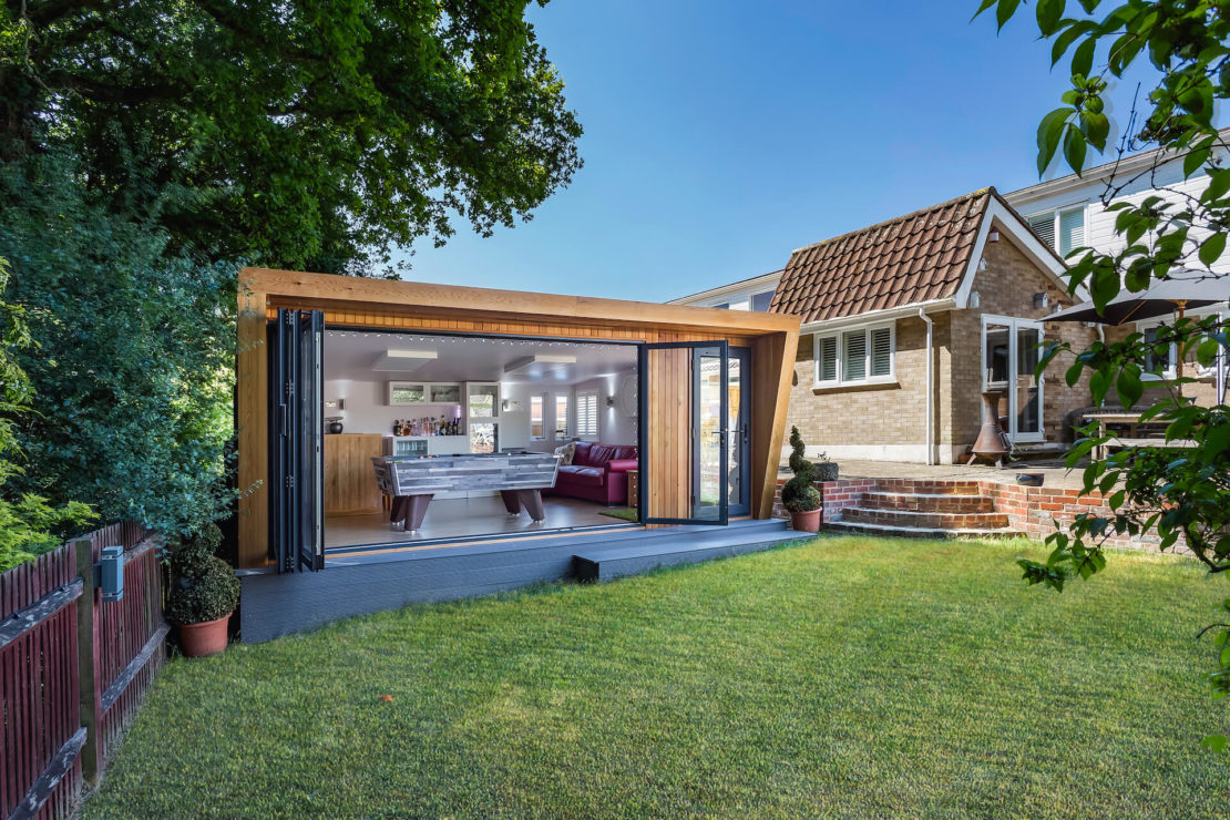 23 Cool Garden Man Cave Ideas to Pimp Your Outdoor Shed 23 luxury garden man cave ideas - a modern shed with bifold doors, with a bar and foosball table inside