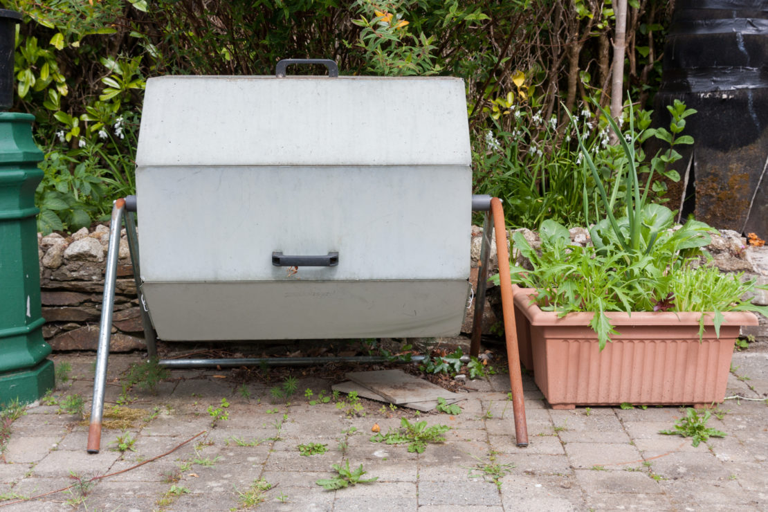 An octagonal metal bin that would rotate on a horizontal axis to turn the compost inside