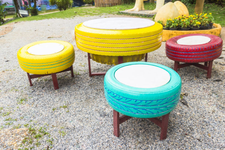 old tyres have been turned into brightly painted stools and a low table