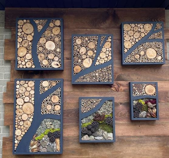 six rectangular bug hotels have been artfully arranged to look like a tree branch