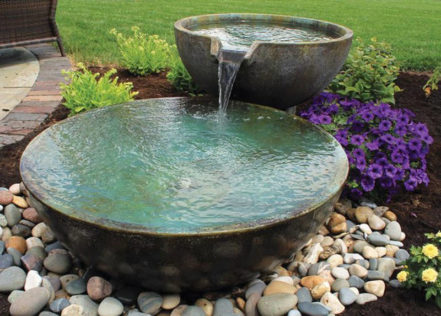sensory garden ideas using two large zen water bowl fountains, with one gently pouring water into the other