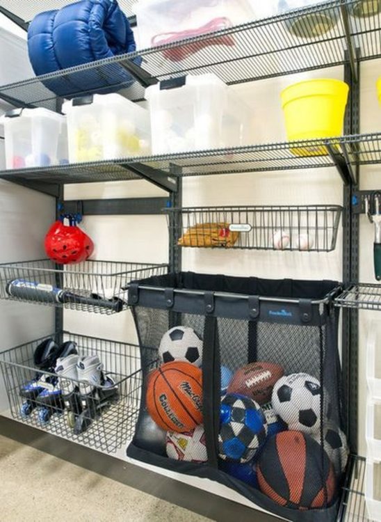 13 Outdoor Toy Storage Ideas for Any Garden Style 2 wire shelves and a huge mesh bag on a rack, attached to a garage wall