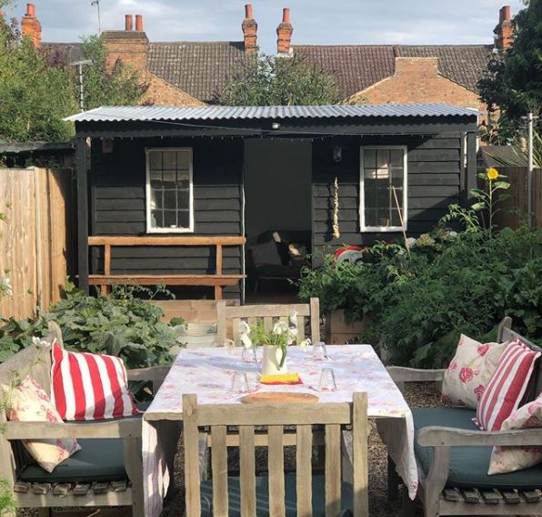 Keep Calm and Carry On: British Themed Garden Ideas 6 a nice garden shed at the bottom of a terraced garden