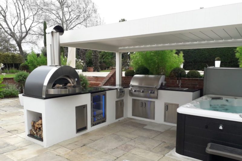 20 Garden Kitchen Ideas For The Perfect Outdoor Cooking Area 1 a hot tub and a luxurious garden kitchen area under a roof