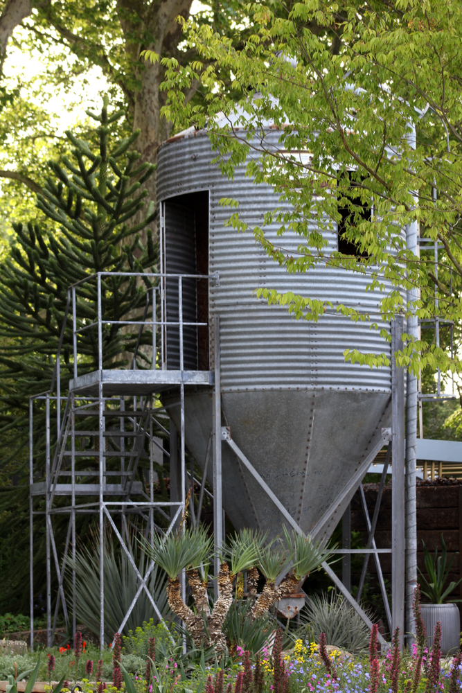 11 Awesome Garden Treehouse Ideas for You (and Your Kids) 12 a grain silo transformed into a space themed play house