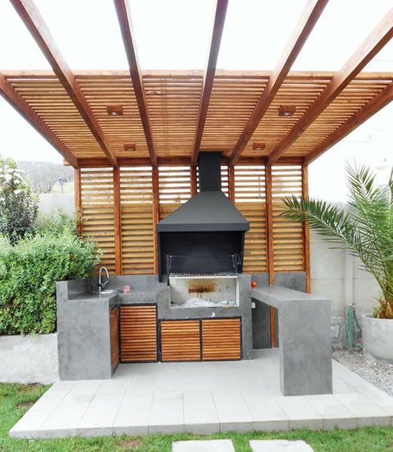 20 Garden Kitchen Ideas For The Perfect Outdoor Cooking Area 12 outdoor kitchen ideas using concrete for surfaces and slatted teak cupboards and pergola