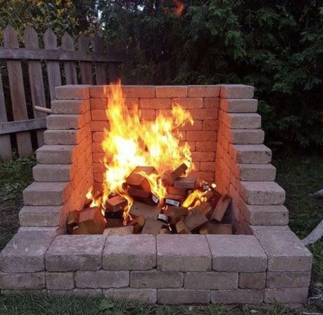 29 Garden Fire Pit Ideas for Cosy Evening Get-Togethers 6 DIY fire pit with an open front made using pale bricks