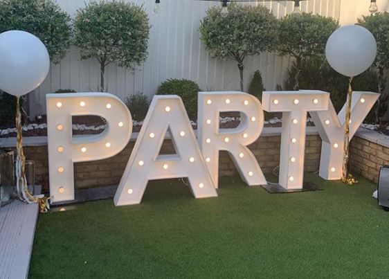 garden party ideas for decorations: large light up letters
