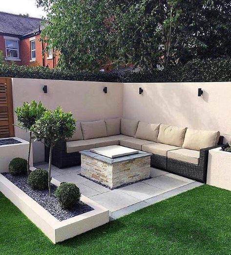 a built-in patio fire pit made from light coloured bricks