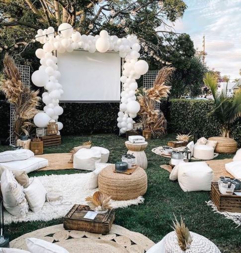 garden party ideas outdoor cinema with balloons and blankets