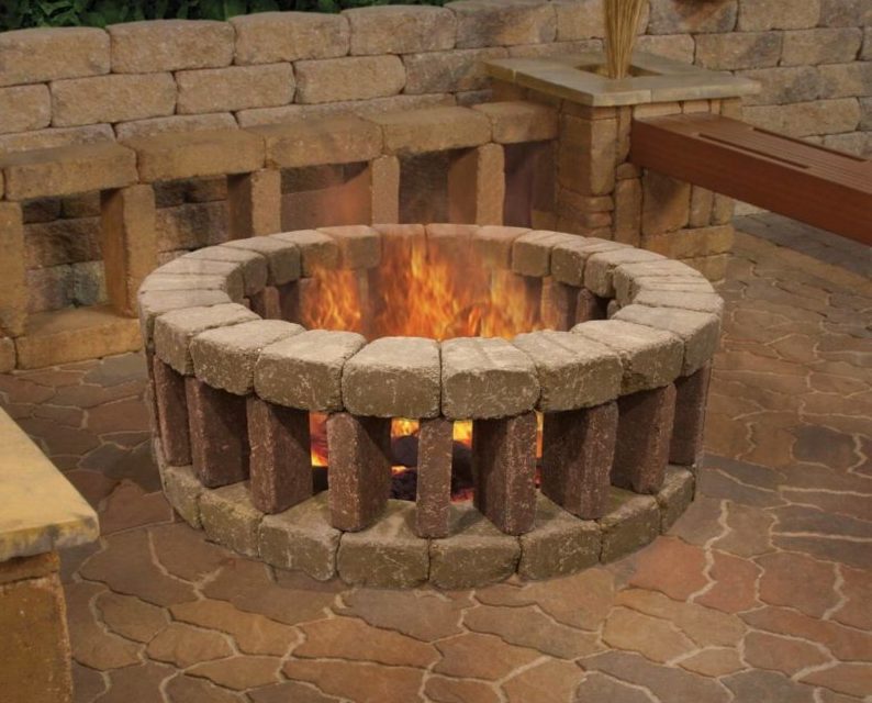 29 Garden Fire Pit Ideas for Cosy Evening Get-Togethers 20 a circular fire pit made from bricks stacked in a pattern