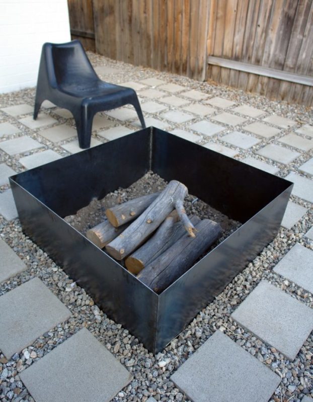 a DIY square metal fire pit on a patio