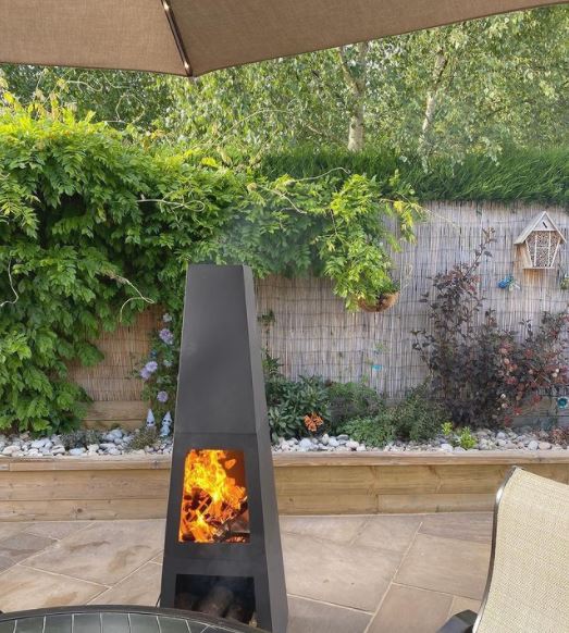 a modern chiminea on a patio
