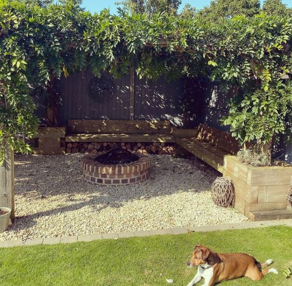 garden heating ideas with a covered seating area a brick fire pit