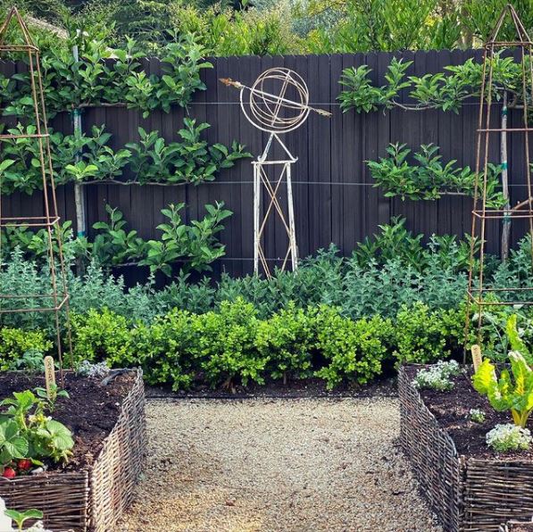 25 English Cottage Garden Ideas: Capture the Fairytale Charm 10 a leafy, cottage garden style kitchen garden