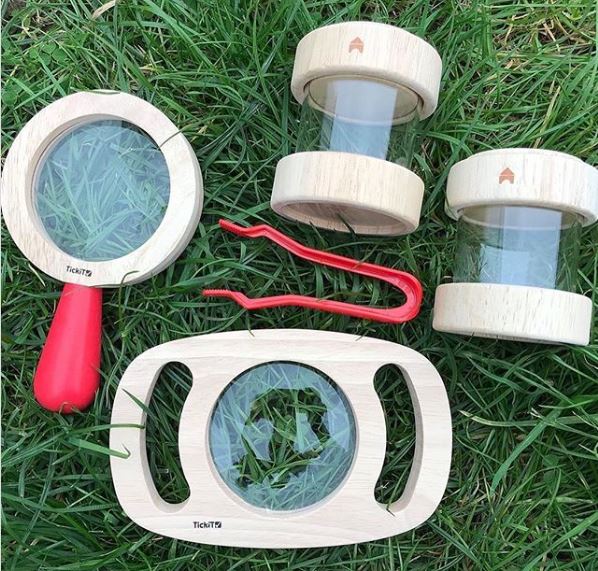 a child-sized kit for collecting bugs, including magnifiers and plastic canisters
