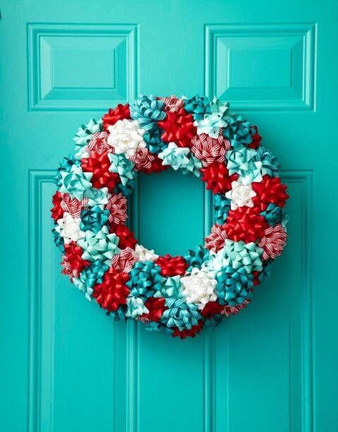 a jolly wreath made from white, red and turquoise gift ribbons
