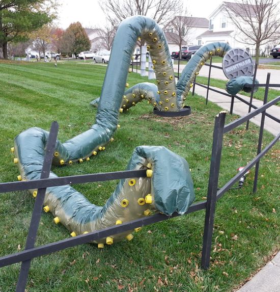 22 Halloween Garden Ideas: Fun & Low-cost Spooky Decorations 22 DIY halloween garden ideas with huge tentacles rising up from a manhole