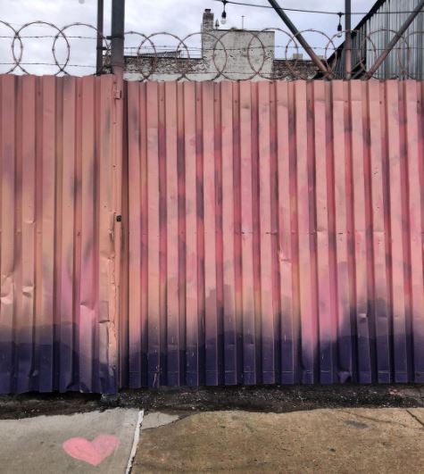 29 Unique Garden Mural Ideas for Outdoor Walls & Fences 7 a fence that fades from shades of pink and coral to black and navy