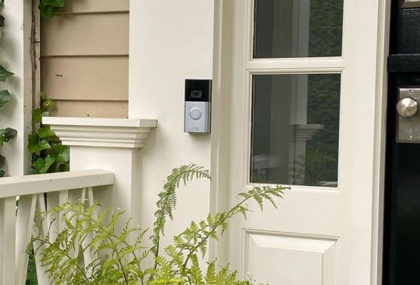 a front porch with a security camera doorbell