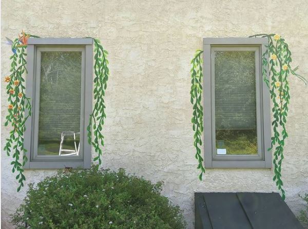 29 Unique Garden Mural Ideas for Outdoor Walls & Fences 21 two outdoor windows with realistic leafy tendrils painted down the sides