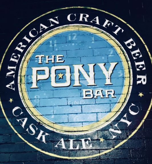 29 Unique Garden Mural Ideas for Outdoor Walls & Fences 24 the logo for a bar painted onto a brick wall