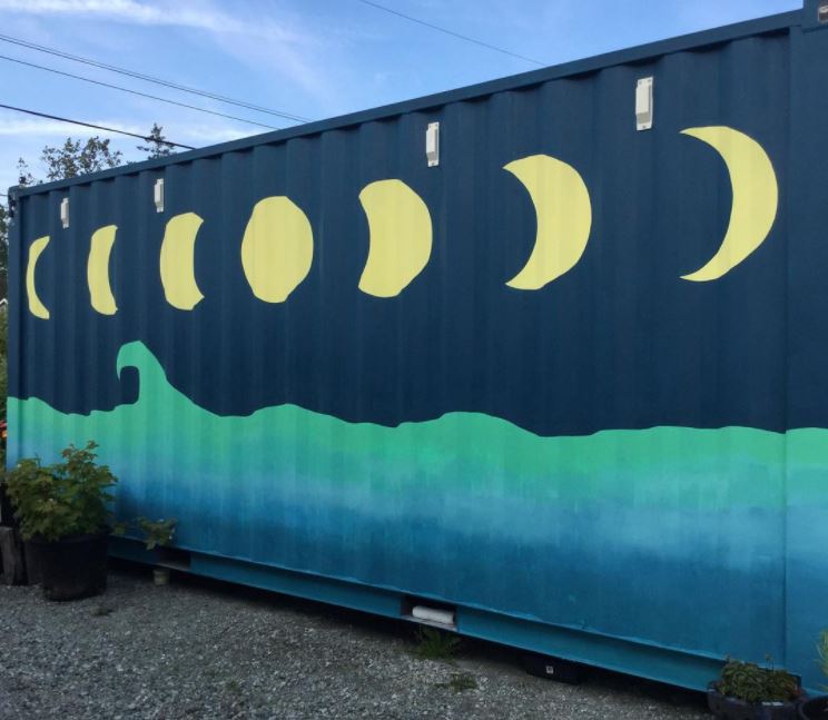 29 Unique Garden Mural Ideas for Outdoor Walls & Fences 2 the side of a containers is painted with a turquoise sea and yellow moon phases