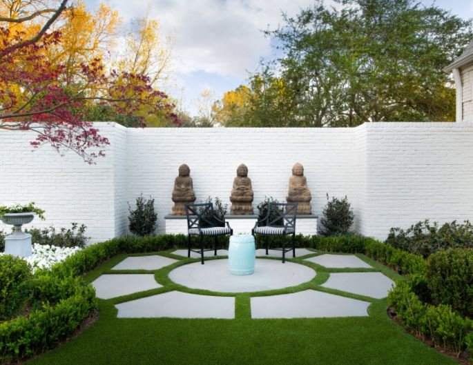 a patio made from irregular slabs that looks like a traditional sun dial or fountain surround