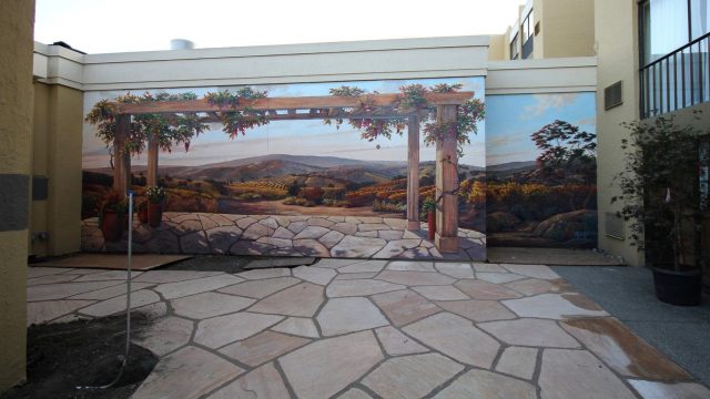29 Unique Garden Mural Ideas for Outdoor Walls & Fences 29 a trompe l-oeil painting that makes it look like a closed patio extends to the horizon