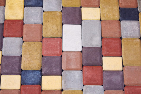 concrete blocks in all shades of red, yellow, grey, blue and purple