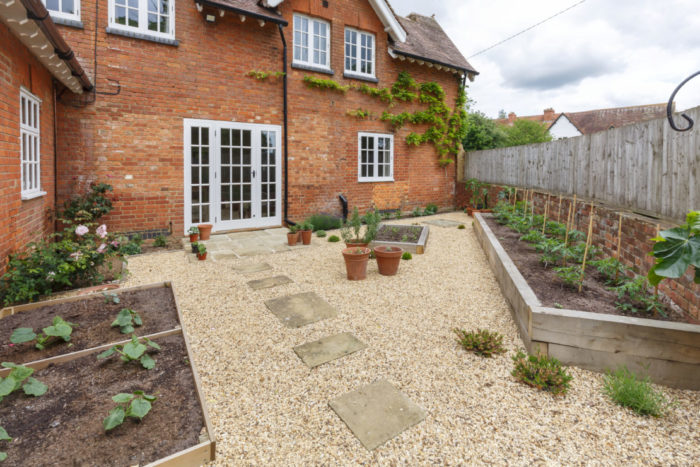 garden security ideas include covering the yard with gravel so visitors are noisy
